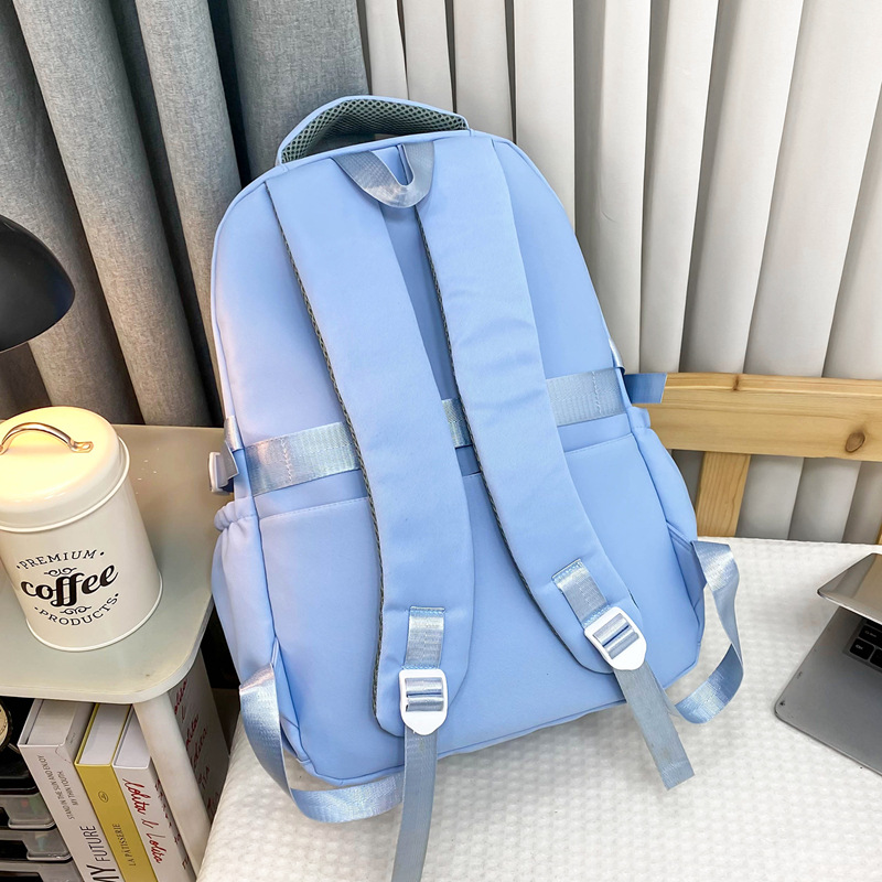 Mayorista nueva mochila de gran capacidad de moda simple campus mochila escolar de tendencia de carga mochila de viaje