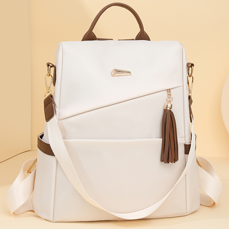 Mochila antirrobo para mujer 2024 nueva moda borla mochila para mujer casual viaje simple mochila escolar al por mayor