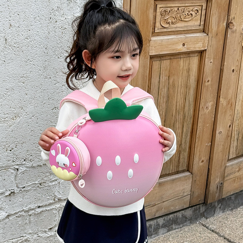 Mochila de dibujos animados para niños y niñas encantadora mochila escolar de estilo de fresa 2025 nueva mochila infantil de cáscara de huevo