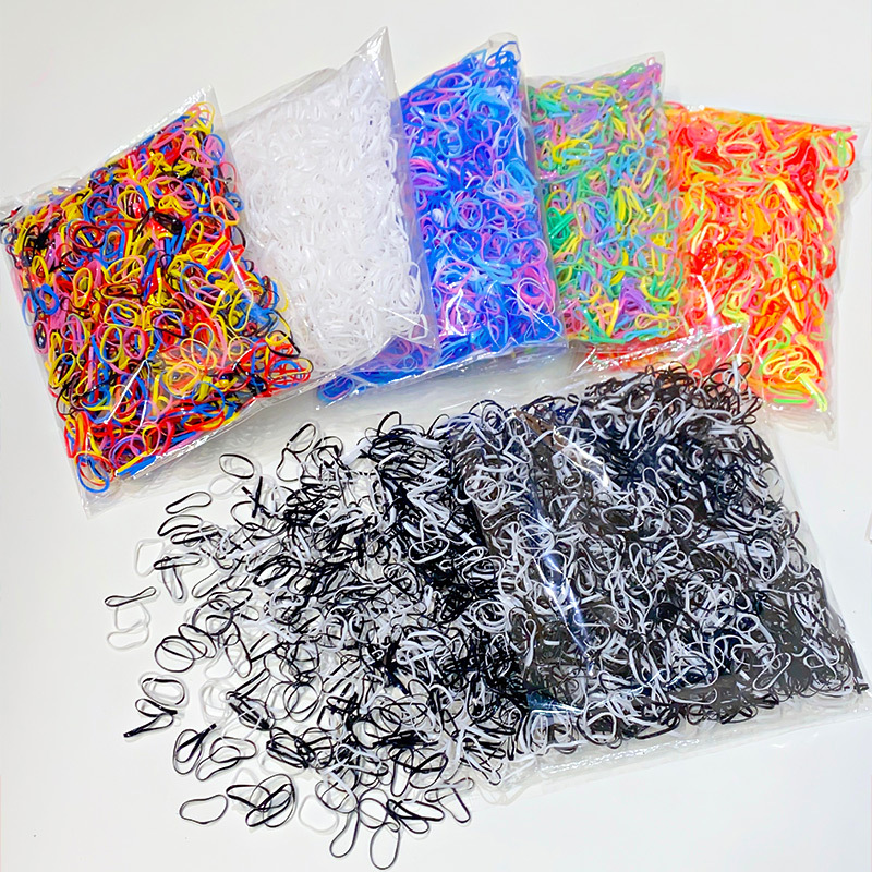 Ventas directas de fábrica para niños 1000 piezas desechables en bolsas pequeña banda de goma banda de pelo al por mayor lazo de Pelo elástico cuerda de pelo accesorios para el cabello
