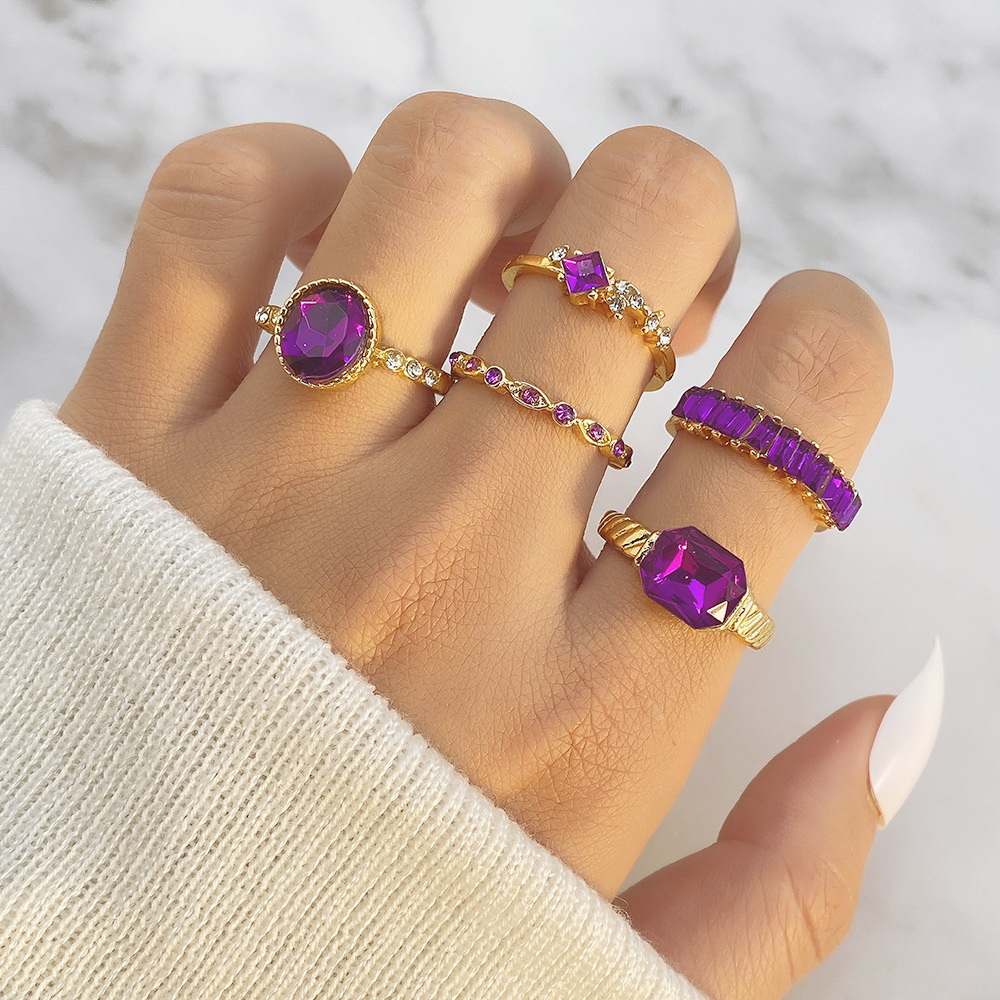 purple ring with stone with zircon