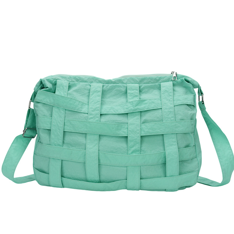 Bolso de mensajero de diseño de nicho 2024 nuevo bolso de hombro tejido hueco tridimensional bolso de hombro de gran capacidad para viajeros