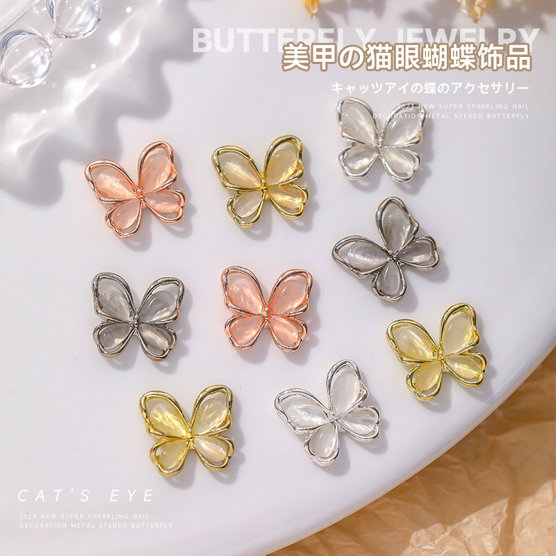 Nueva joyería de diamantes de uñas estilo caliente ojo de gato mariposa tridimensional súper flash ligero lujo hueco rojo de la red portátil armadura accesorios de diamantes grandes