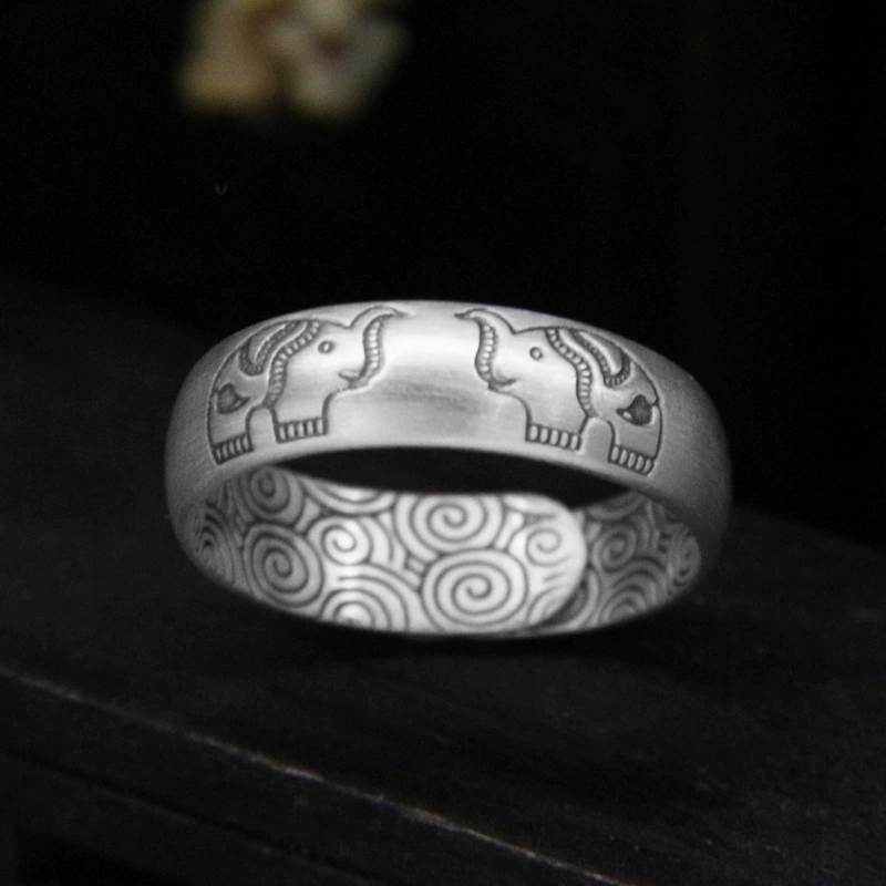 Silver bracelet, retro design ring, on index finger