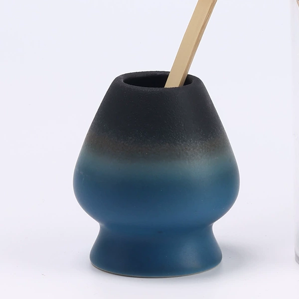 Gradient black and blue of distant mountains, standing tea
