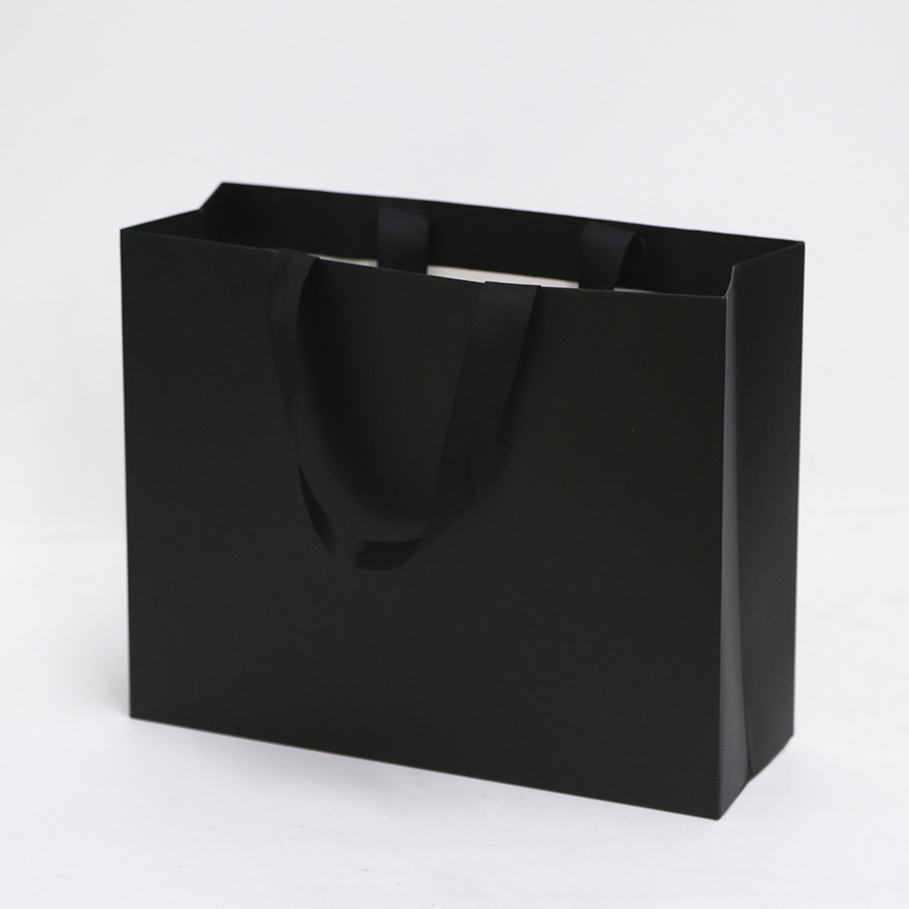 Bolsa de cartón blanco logotipo tienda de ropa bolsa de mano bolsa de regalo espesa bolsa de regalo de Navidad se puede imprimir