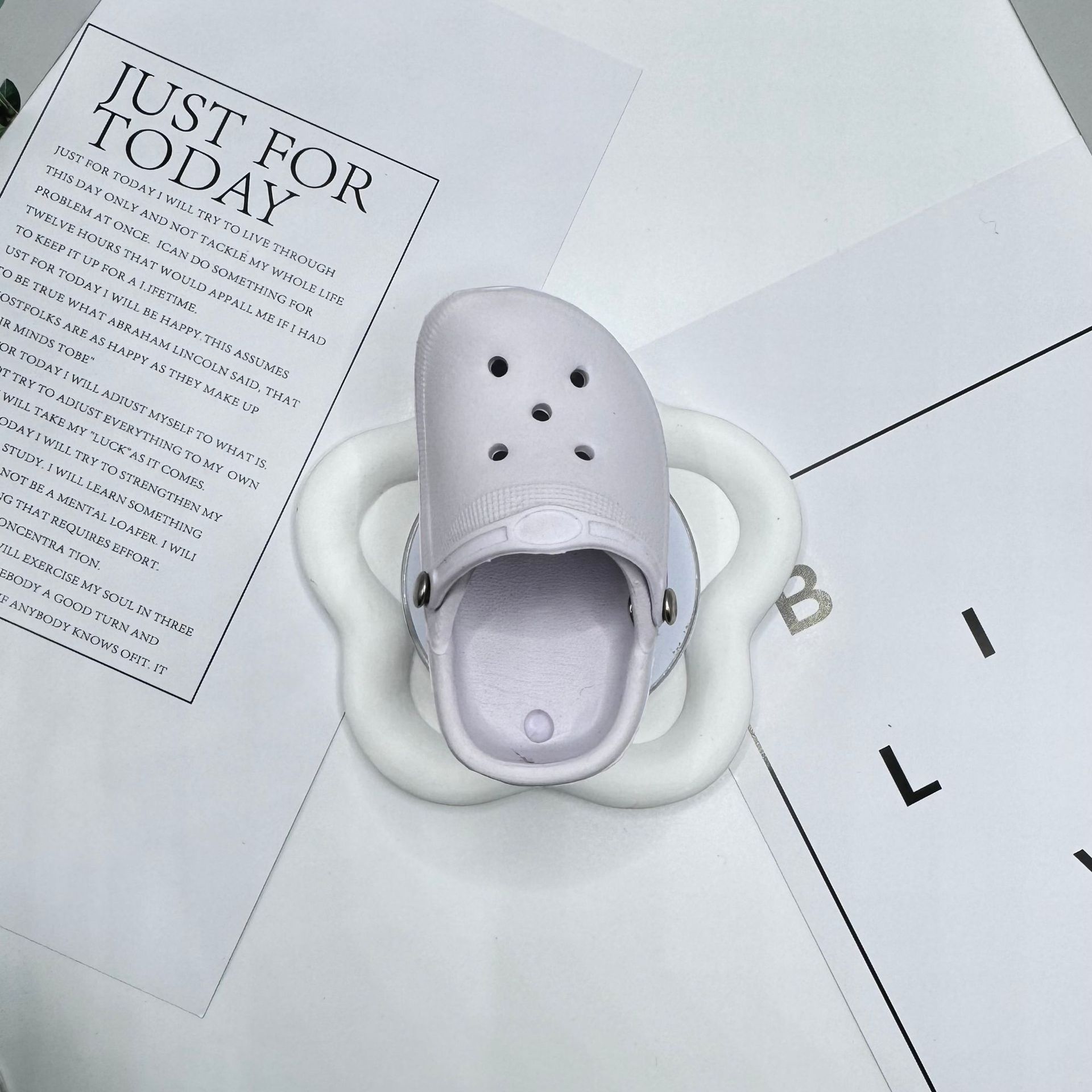 White Crocs-style slippers