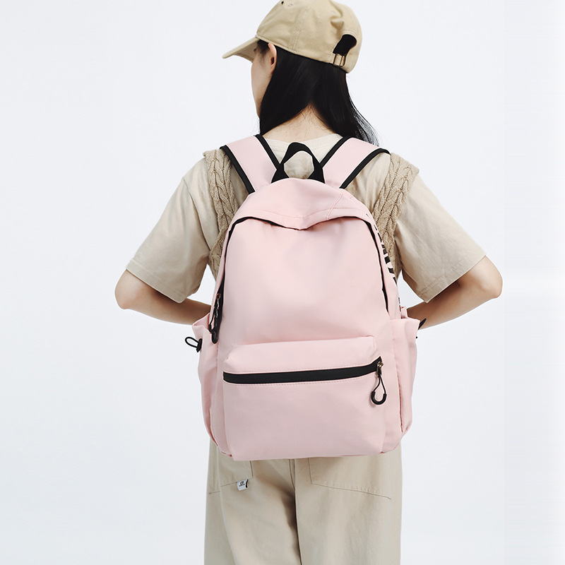 Nuevo estilo coreano en una pequeña mochila de color sólido fresco, mochila de gran capacidad, mochila de alto valor, mochila de estudiantes de moda.