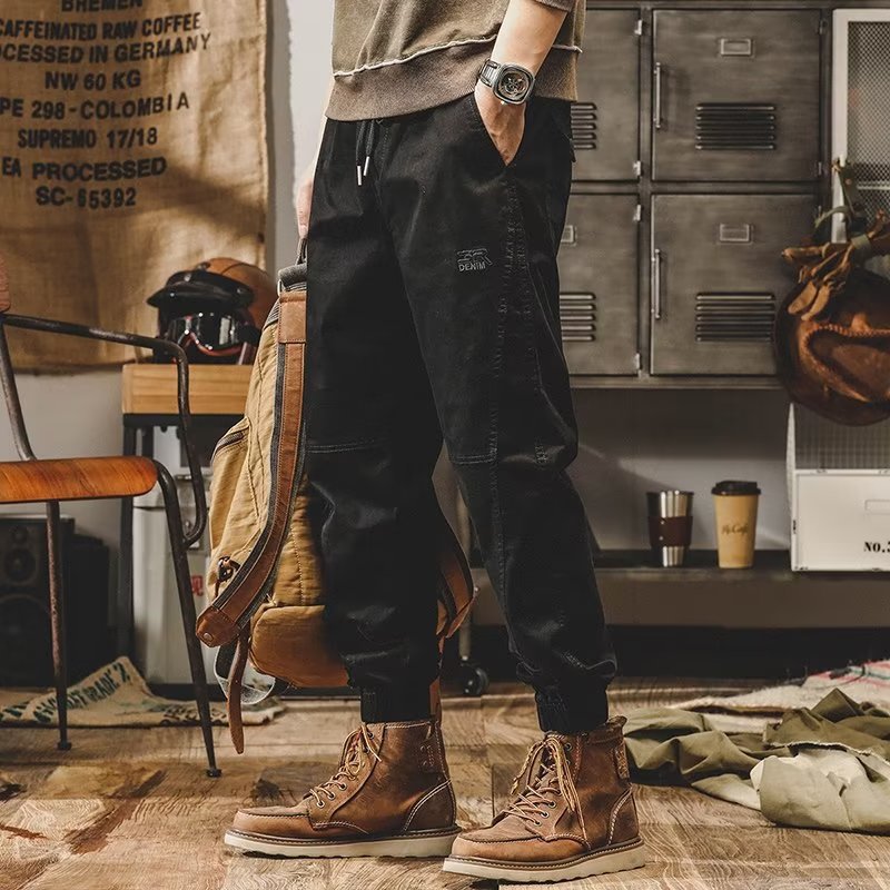 Pantalones casuales para hombres Primavera y otoño Nueva marca de moda coreana suelta más pantalones atados al tobillo pantalones al aire libre con volantes pantalones harén guapos en stock al por mayor