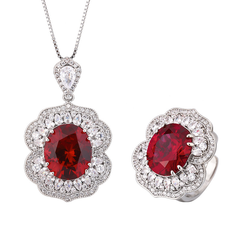 Otoño e invierno Nueva Zhuang Sheng joyería de cobre inferior chapado en oro simulación rojo corindón zafiro azul cristal puntiagudo traje avanzado femenino 12*14