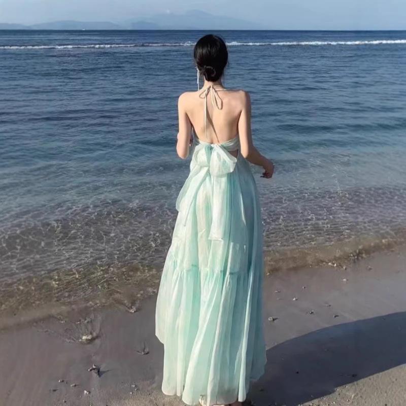 Mint Mambo Seaside Vacation Vibe Beach Dress with a Stylish Halter Neck Design, Fairy-Like Elegance, and a Large Flared Skirt Mint Mambo Seaside Vacation Vibe Beach Dress with a Stylish Halter Neck Design, Fairy-Like Elegance, and a Large Flared Skirt