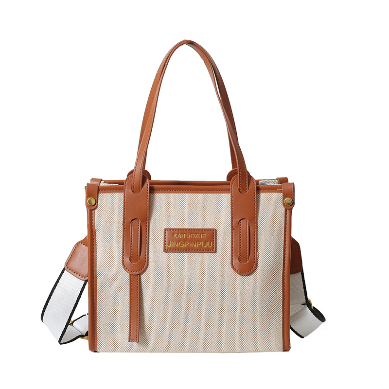 Bolso de mano de lona de color contrastante para mujer, nuevo estilo coreano transfronterizo, bolso de hombro tipo bandolera para ir al trabajo de alta gama