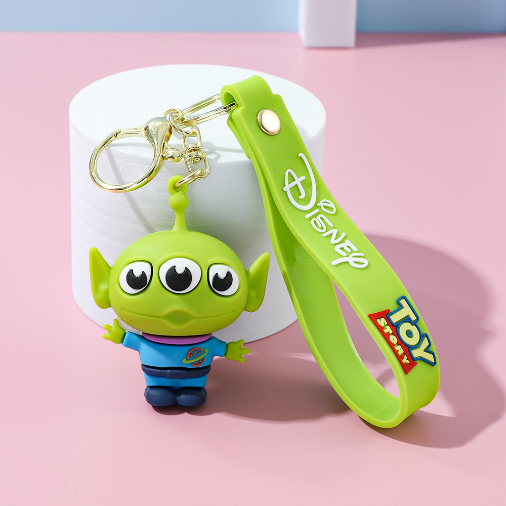 Llavero de silicona de Toy Story, el popular dibujo animado, con personajes como el alienígena de tres ojos, Buzz Lightyear y el oso Lotso, ideal como adorno para bolso.