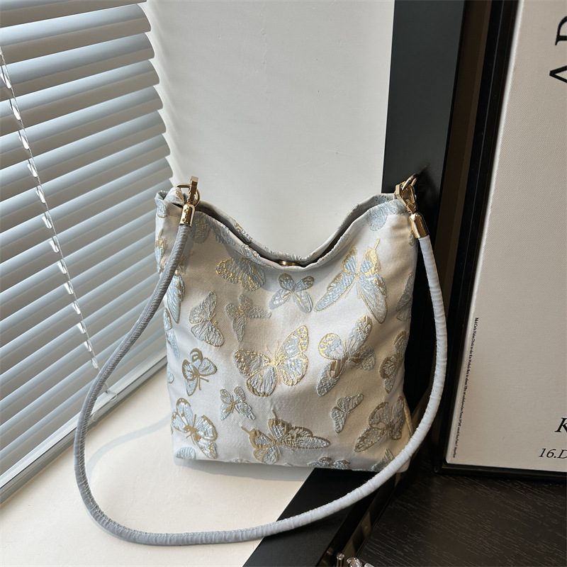 New Guofeng Jacquard canvas bolsas para mujeres 2024 verano nuevo popular bolso de hombro universal para viajar bolsas de cubo debajo de las axilas