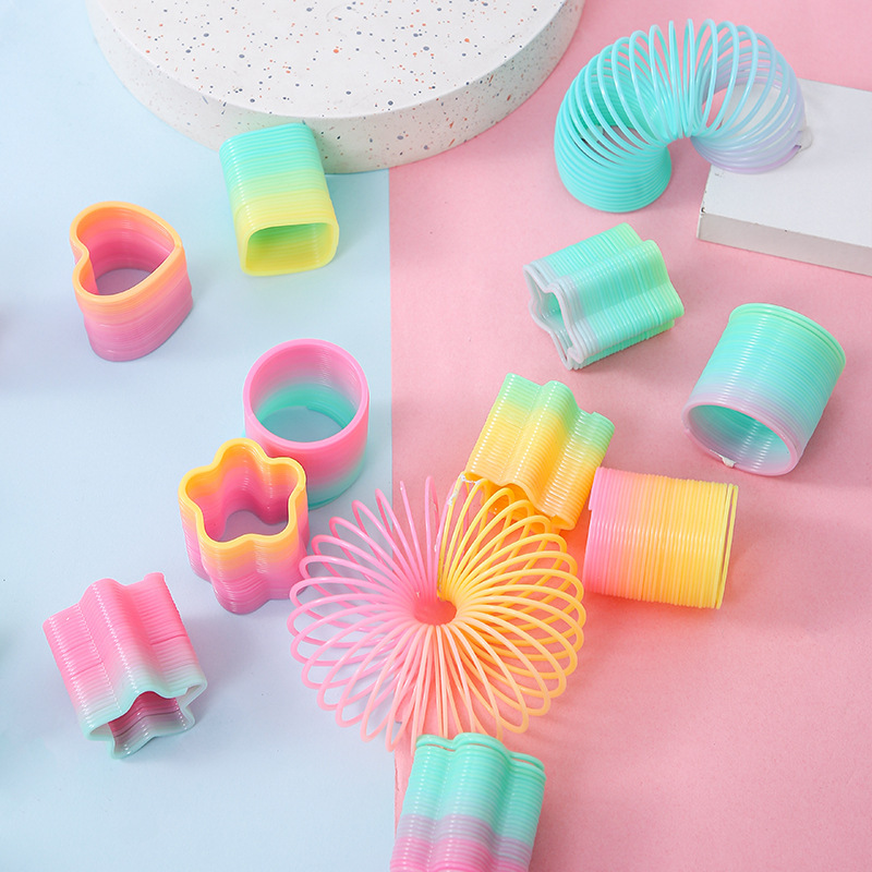 Fábrica directa pequeña mágica arco iris círculo de estudiantes juguetes de puzzle mini bobina de forma extraña mercado nocturno tienda de suministro