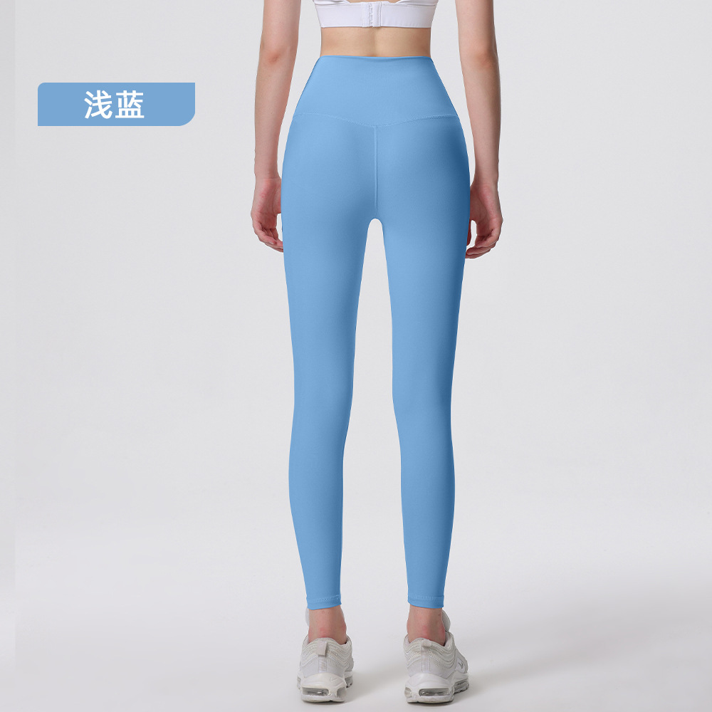 Nuevos deportes de yoga cintura alta desnuda sensación de no vergüenza línea piel-friendly levantamiento de la cadera del vientre que no se contrae la caída de la aptitud de las mujeres pantalones recortados