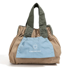 2025春夏新款韩系简约撞色小清新单肩包尼龙布水桶包单肩斜跨包