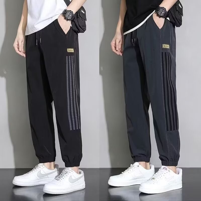 Pantalones de seda de hielo, pantalones deportivos de secado rápido de verano para hombres, pantalones casuales de nueve puntos sueltos y delgados de la marca de moda, pantalones casuales de nueve puntos al por mayor