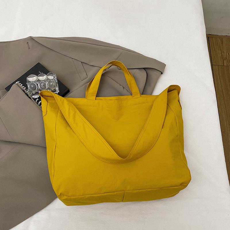 Simple relajado sensación de gran capacidad bolso de lona de hombro de mujer hollow viento versátil bolso de mochila