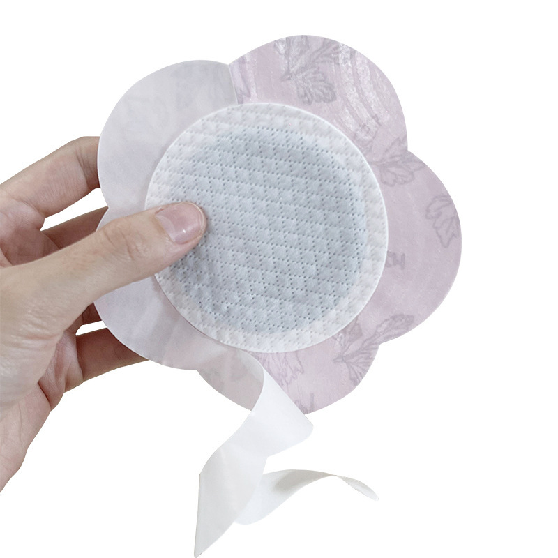 陶博士の十二味の精油の熱い布は花型のバラの灸を貼ります。|undefined