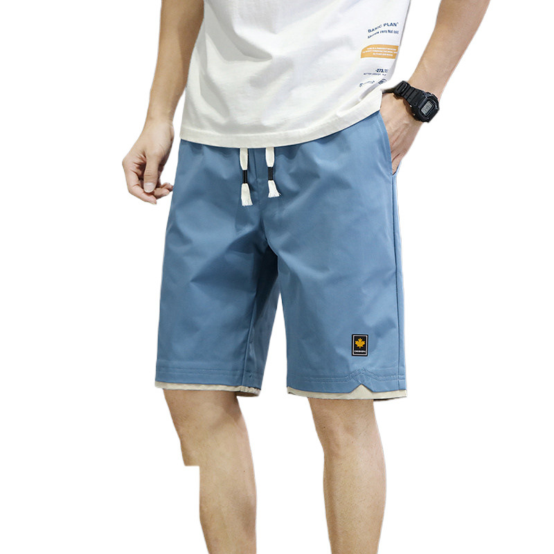 Pantalones de playa casuales para hombres, pantalones cortos de verano de cinco puntos, pantalones largos y sueltos para hombres, fábrica de siete puntos.