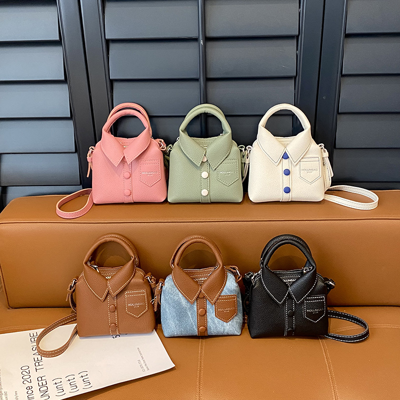 Tendencia personales bolsas de ropa de chicas modas simples de color sólido mini mochila de bebé 2025 nueva bolsa para niños