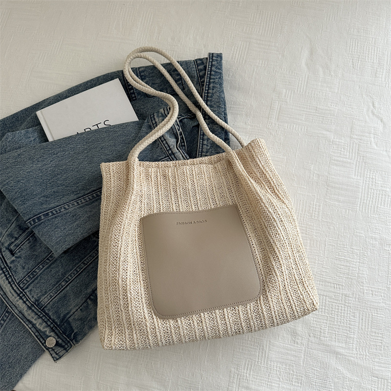 Bolsa de tejido de gran capacidad para mujeres 2024 nueva moda bolso de hombro de aire extranjero de alta calidad sensación de tela de paja bolso de mujer bolso especial