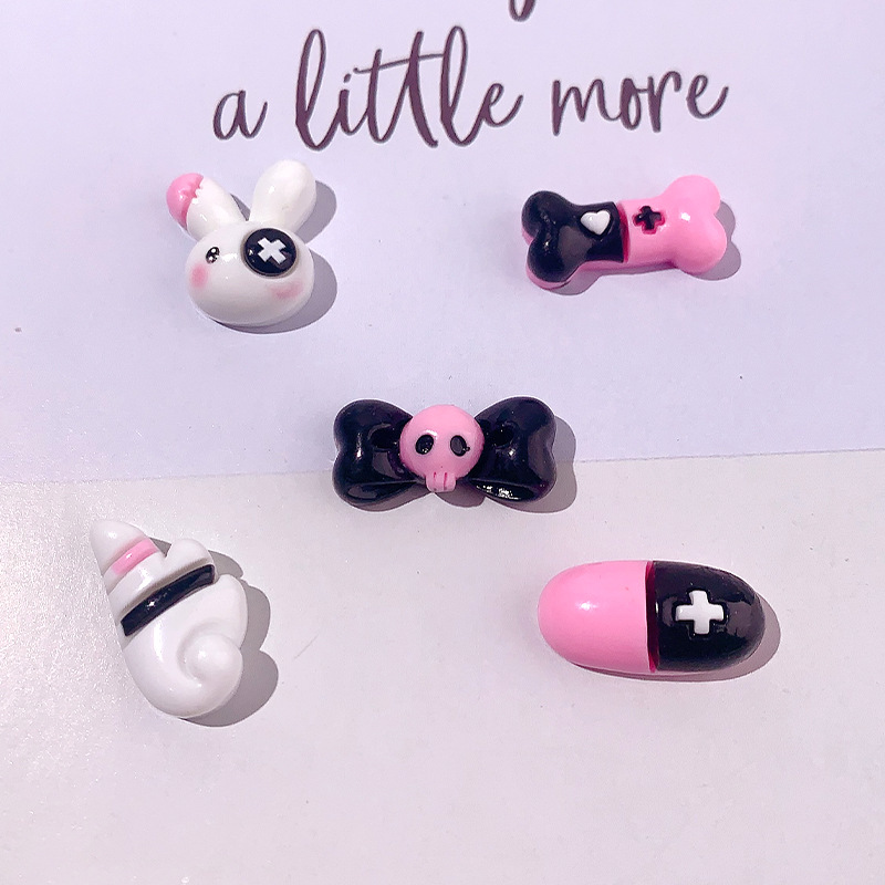 Caricatura dulce serie cool cráneo arco accesorios de resina DIY pegamento crema caja de teléfono móvil adornamiento de cabello agujero botón de zapato