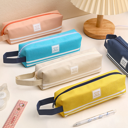 Japanese simple large-capacity pencil bag wholesale student portable pencil bag creative solid color Oxford cloth pencil bag