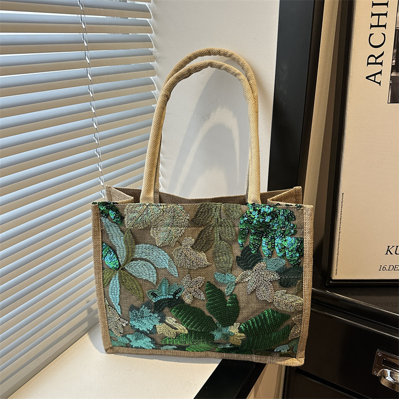 Explosiones transfronterizas 2026 textura de lino de alta calidad, flores bordadas, bolsas de tendencia horizontales, bolsas de compras de aire exterior