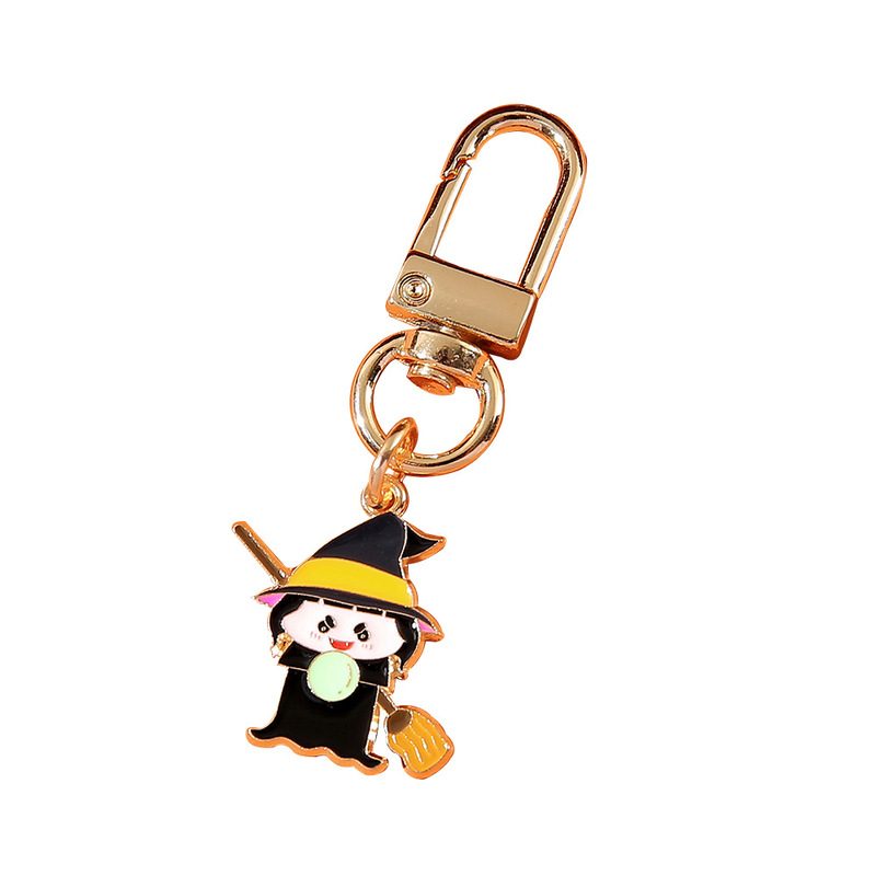 国境を越えてハロウィーンシリーズのアニメかわいいカボチャの頭帽の幽霊のキーホルダーに飾られた女性の本のストラップ|undefined