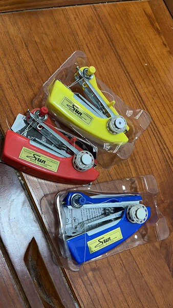 Manual sewing machine. Mini sewing machine. Small sewing machine