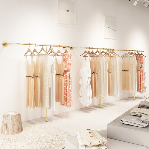 Golden clothing store display rack wall-mounted hanging rods against the wall combination hanging women's clothing store shelves