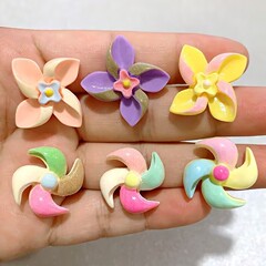 カラフルな回転風車 diy クリーム接着剤ヘアピン携帯電話ケース車の風車下駄バックル材料卸売