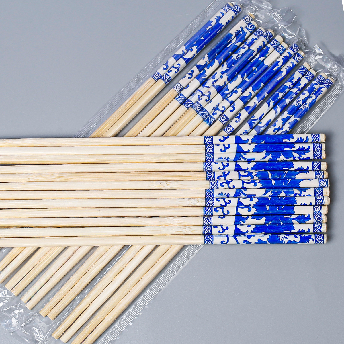 Palillos desechables grandes lotes de palillos redondos gruesos y largos de 24cm 50 pares de un paquete de palillos de película de impresión Embalaje independiente al por mayor