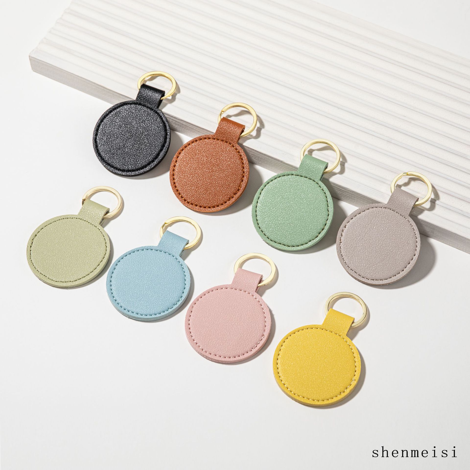 Keychain de cuero pu transfronterizo estilo simple y redondo logotipo impresa colgante de cuero llavero para hombres y mujeres