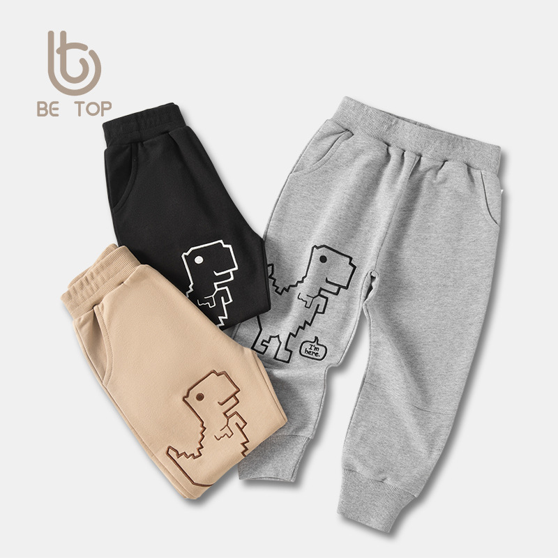 Pantalones para niños nuevos pantalones deportivos para niños de primavera pantalones casuales para niños coreanos pantalones de dinosaurio de estilo occidental simple para niños