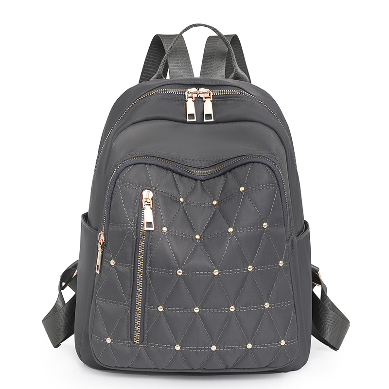 Mochila de nailon bordada de rombo para mujer 2024 nuevo estilo casual para mujer mochila de viaje ligero para viajeros urbanos