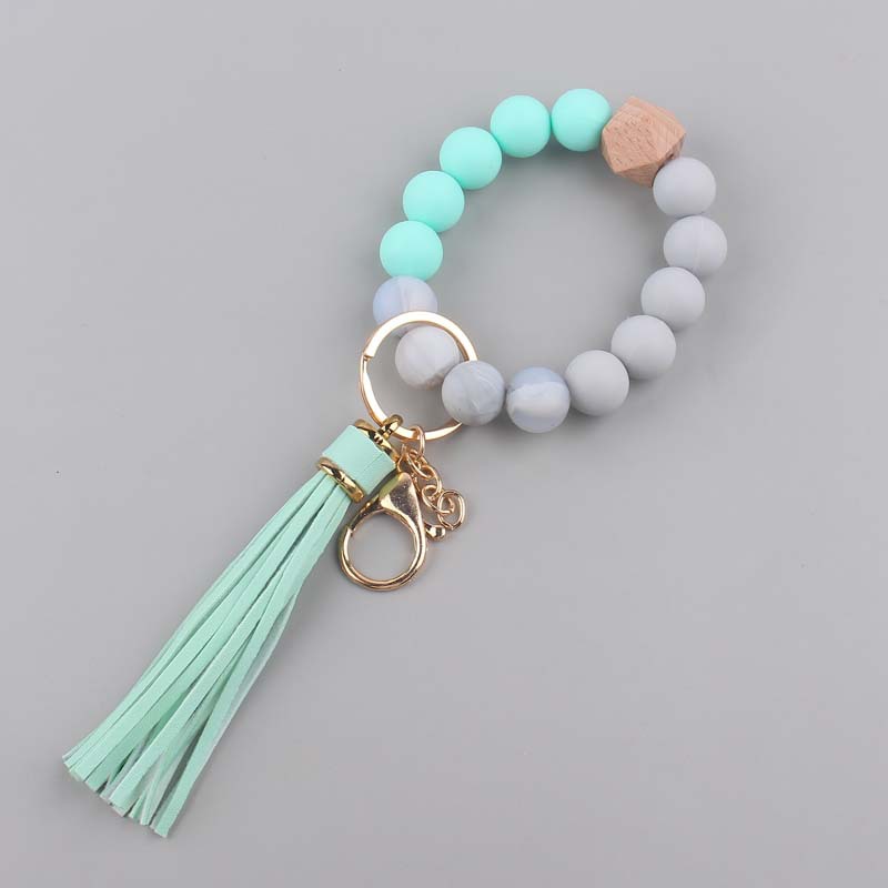 Nuevo cuero creativo pu borla colgante silicona muñeca llavero colgante silicona cuentas pulsera llavero