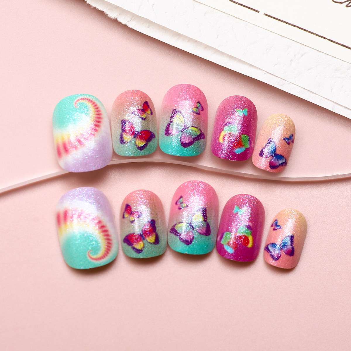 Juego de 24 piezas de uñas postizas para niños con diseño de dibujos animados, desmontables con adhesivo y exquisito diseño.