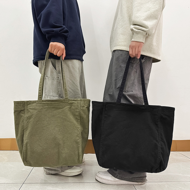 Bolso tote de lona de color sólido retro de gran capacidad de viento perezoso 2025 nuevo bolso de hombro simple de moda al por mayor