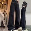 Black colored design loose straight jeans, fitted trousers, trend of season