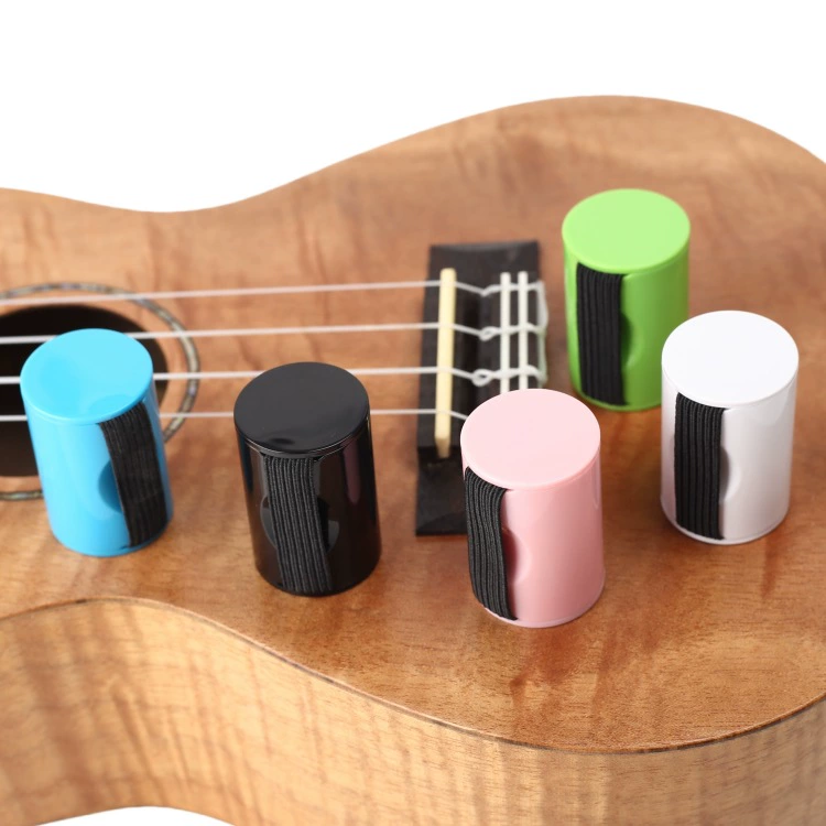 Maracas with a score, ukulele, multicoloured guitar