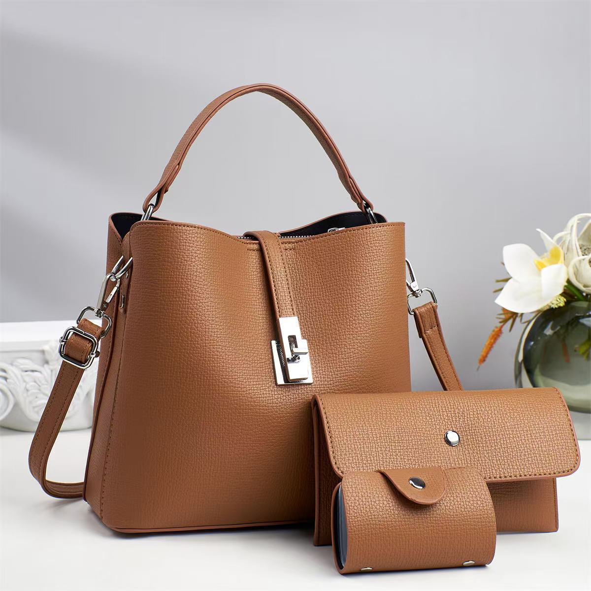 Bolsa de cubo de textura de temperamento 2025 nuevo bolso de hombro práctico bolso de mensajero de viaje casual ladiesbags