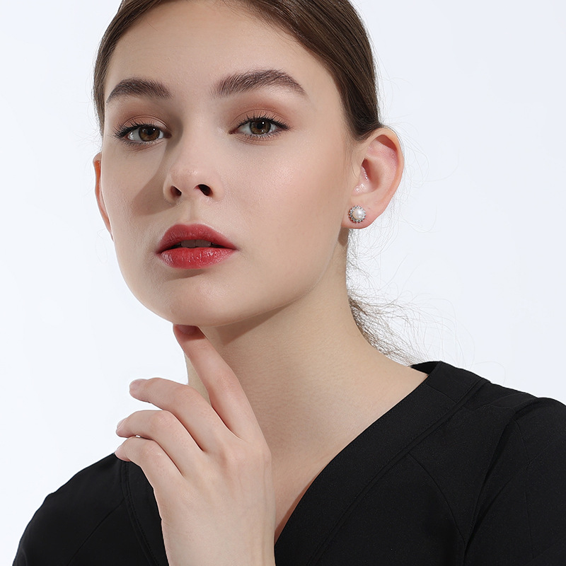 Pendientes de perlas de agua dulce 925 plata esterlina luz lujo nicho simple girasol Otoño e Invierno pendientes de alta calidad para las mujeres