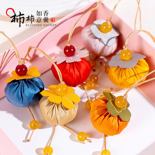 Mini persimmon-shaped sachet with sandalwood for the Dragon Boat Festival at Lingyin Scenic Area, bringing good luck and the wish for 