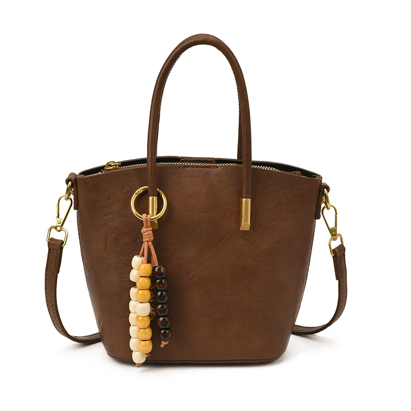 Bolsa de mano de textura retro de gran capacidad para mujeres otoño y invierno 2025 nuevo tipo de mochila de transporte público bolsa de hombro universal