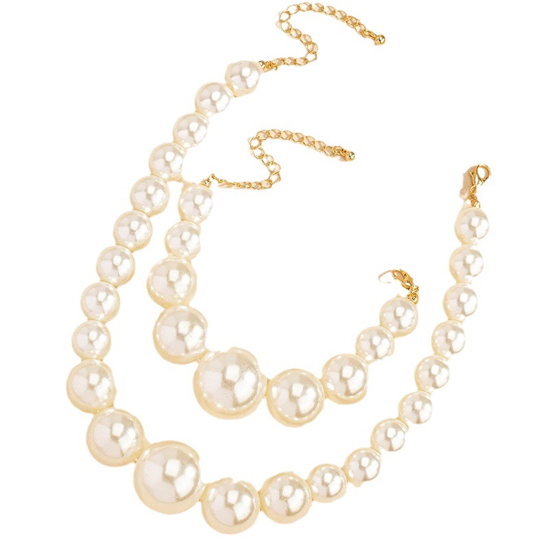 Francés estilo retro Palacio pendientes de perlas de agua dulce collar de la pulsera traje femenino nicho de alto grado de luz de lujo cadena de la clavícula