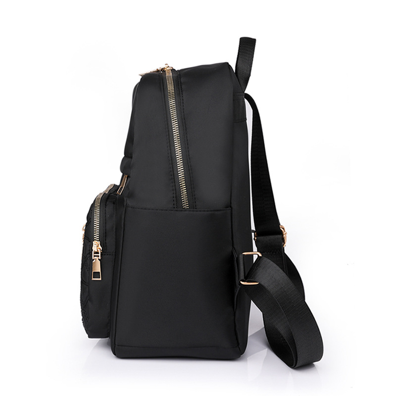 Comercio exterior al por mayor 2023 nueva versión coreana de la mochila de nailon para mujer, línea de bordado de moda, mochila de viaje al aire libre de todo fósforo, marea