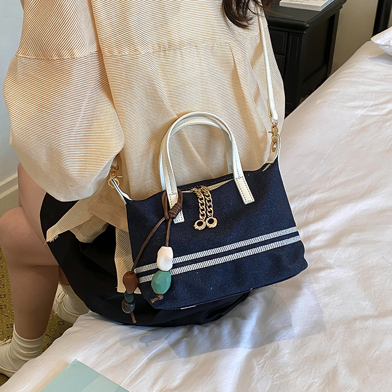 Tela estriada bolso de bolsillo de mano mujer 2026 venta caliente nuevo estilo de alta calidad sensación de moda versátil bolso de hombro